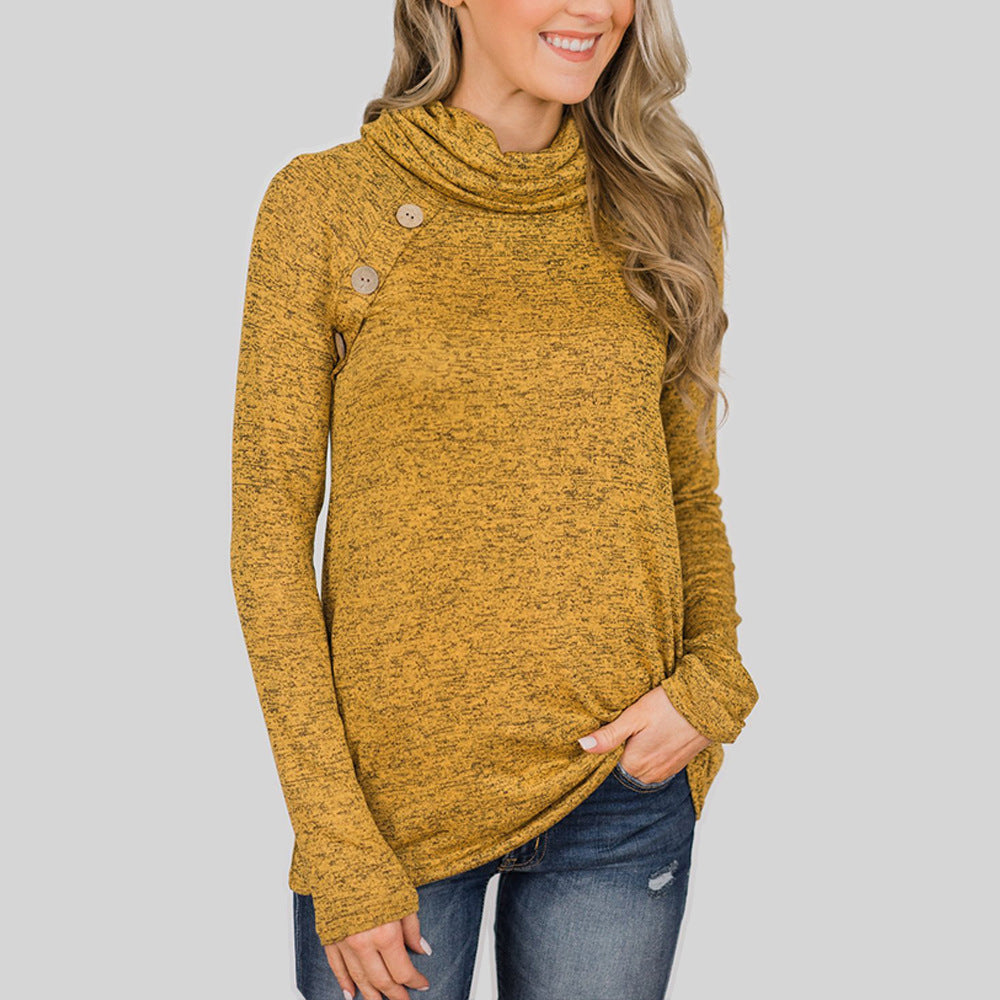 Woman wearing a mustard yellow sweater with a plain background